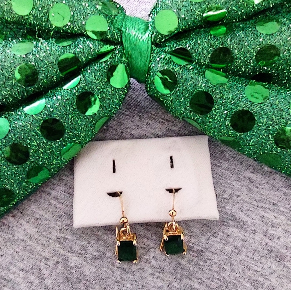 Emerald cut faux emeralds in yg colored setting